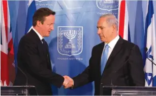  ?? (Tali Mayer/Walla, pool) ?? BRITISH PRIME MINISTER David Cameron shakes hands with Prime Minister Binyamin Netanyahu in the capital yesterday.