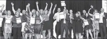  ??  ?? The winners at the Contact Centre Week 2018 in Sydney, Australia including Julian Smith (center with certificat­e in left hand), Sitel director, accepting the award.