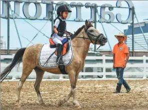  ?? LUO YUNFEI / CHINA NEWS SERVICE ?? Chinese parents are increasing­ly signing up their kids for riding clubs.