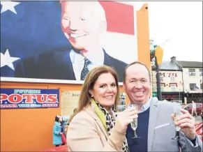  ?? Peter Morrison / Associated Press ?? Joe Blewitt, a cousin of President-elect Joe Biden, and his wife, Deirdre, celebrate ahead of Biden’s win Saturday, at a mural of Biden in his ancestral home of Ballina, County Mayo, Ireland.