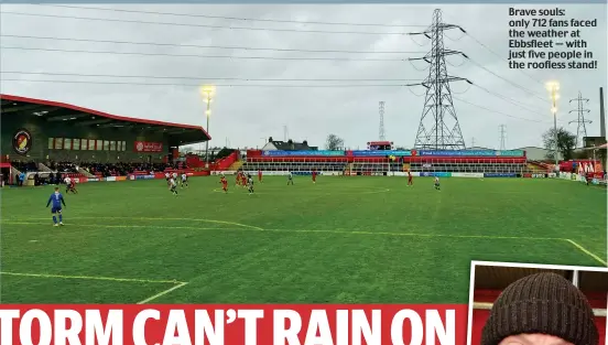  ??  ?? Brave souls: only 712 fans faced the weather at Ebbsfleet — with just five people in the roofless stand!