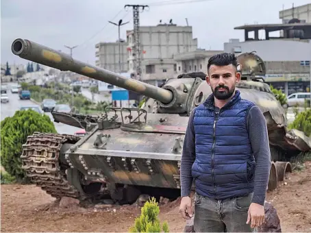  ?? AFP ?? A man stands at the ‘Free Woman’ square in the northern Syrian city of Kobane, a Kurdish-majority area near the Turkish border.