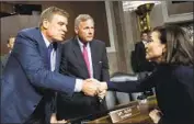  ?? Tom Williams CQ Roll Call ?? U.S. SEN. Mark Warner, left, greets Facebook COO Sheryl Sandberg at a Senate hearing last year.