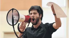  ?? PHOTO: GREGOR RICHARDSON ?? Getting the message across . . . Opoho School teacher Sandor Toth leads the chant at a strike rally at the Edgar Centre in Dunedin yesterday morning.