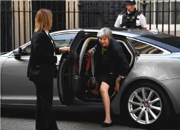  ?? — Reuters photo ?? May returns to Downing Street from the Houses of Parliament in London, Britain.