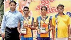  ??  ?? The winner of the men’s and women’s Nestomalt Half Marathon Ajith Bandara and Champika Malkanthi poses for a picture with their trophies along with Chandana Fernando, Sales Manager Nestle PLC and Prema Pinnawela, Secretary of AAA.