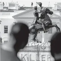  ?? AP ?? In June, four men were charged for attempting to take down the statue of Andrew Jackson in Lafayette Park in Washington, D.C.