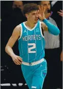  ?? DAVID ZALUBOWSKI – AP ?? Hornets rookie LaMelo Ball gestures after hitting a 3-pointer against the Nuggets.