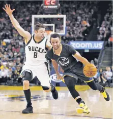  ?? Stephen Lam / Special to The Chronicle ?? Stephen Curry drives toward the basket as Matthew Dellavedov­a defends during the Warriors’ win at Oracle.