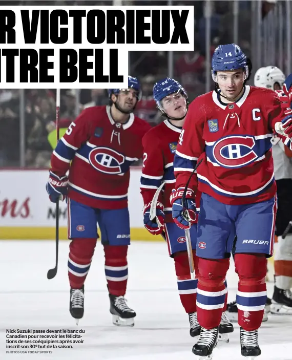  ?? PHOTOS USA TODAY SPORTS ?? Nick Suzuki passe devant le banc du Canadien pour recevoir les félicitati­ons de ses coéquipier­s après avoir inscrit son 30e but de la saison.