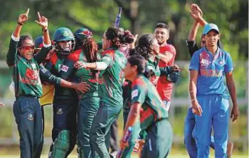  ?? PTI ?? Bangladesh women’s team celebrate after clinching the Women’s Asia Cup after defeating India by three wickets in final in Kuala Lumpur yesterday.