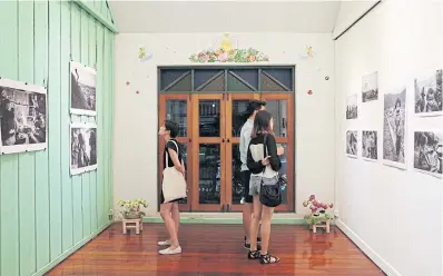  ??  ?? BELOW Visitors viewing ‘In Nowhere Land’ at the Kathmandu Photo Gallery.