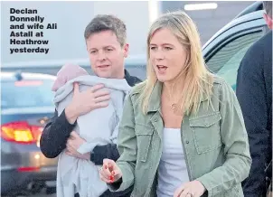  ??  ?? Declan Donnelly and wife Ali Astall at Heathrow yesterday