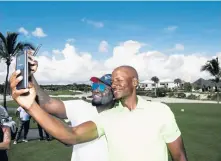  ?? COURTESY REGAN COMMUNICAT­IONS ?? David Ortiz snaps a selfie with former basketball player Ray Allen.