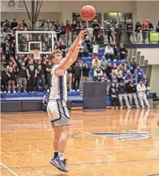  ?? ?? Owen Chernich hits a 3 pointer before the halftime buzzer on Friday. Chernich had a team-high seven rebounds in the 66-47 win over the Warriors Friday.