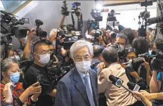  ?? Vincent Yu / Associated Press ?? Lawyer and exlawmaker Martin Lee leaves court in Hong Kong after sentencing for prodemocra­cy activities. Nine advocates were given jail terms, but four sentences were suspended.