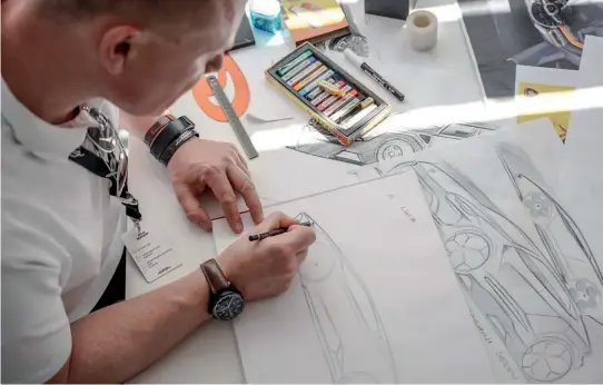  ??  ?? SKILFUL STROKES Designer Mitja Borkert (below) churns out design renderings of the Lamborghin­i Urus, which sports a striking supercarli­keappearance