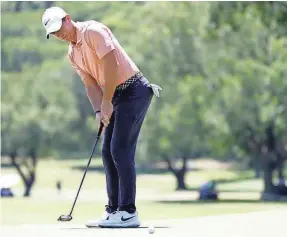  ?? RAYMOND CARLIN III/USA TODAY SPORTS ?? Rory McIlroy putts during the 2020 Charles Schwab Challenge, the PGA Tour’s first event after the COVID-19 pause.