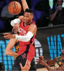  ?? Mark J. Terrill / Associated Press ?? Russell Westbrook runs into trouble on a night when he committed seven of the Rockets’ 22 turnovers.