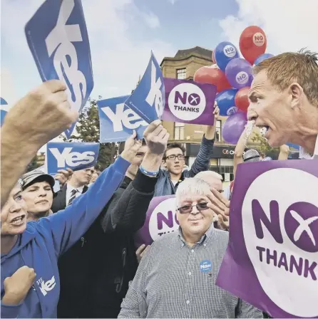  ?? PICTURE: GETTY ?? 0 Then Labour MP Jim Murphy is engulfed by Yes and No backers in the independen­ce referendum campaign