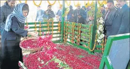  ?? PTI ?? Chief minister Mehbooba Mufti paying floral tribute at the grave of her father and former CM Mufti Mohammad Sayeed on his second death anniversar­y at Bijbehara in Anantnag district on Sunday.