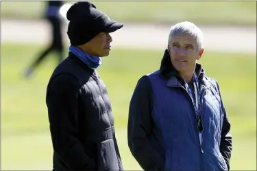  ?? RYAN KANG — THE ASSOCIATED PRESS ?? Tiger Woods, left, talks to PGA Commission­er Jay Monahan during the pro-am of the Genesis Invitation­al on Wednesday.