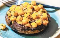  ?? LAURA CHASE DE FORMIGNY FOR THE WASHINGTON POST ?? Thick-as-steak mushrooms from award-winning food writer Nigel Slater get topped with a silky hummus-esque puree and whole chickpeas, for a surprising­ly elegant dinner for two.