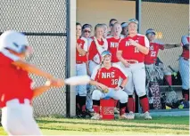  ?? TERRY/ THE OKLAHOMAN] ?? Members of the North Rock Creek softball team watch from the dugout during their scrimmage Friday night in Shawnee. [BRYAN