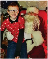  ??  ?? Darragh Hegarty meeting Santa Claus in his grotto.