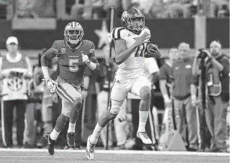  ?? Ronald Martinez / Getty Images ?? Kellen Mond, a true freshman last season, started eight games at quarterbac­k when Nick Starkel went down with an injury in the opening game. He relinquish­ed the job to Starkel for the final four games.