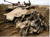  ?? ?? A Panther Ausf A and Sd.Kfz 251/7 in field. A motorcycle combinatio­n supports the drive