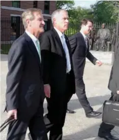  ?? BRADEN BUNCH, THE ITEM ?? Tuomey President and CEO Jay Cox, center, leaves the courthouse with the hospital’s legal team during a four-week trial in Columbia, S.C.