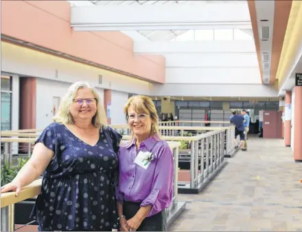  ?? COLIN MACLEAN/JOURNAL PIONEER ?? Barb Mann, left, and Gayelene Cook-Angus are two of about 100 employees who have been with the P.E.I. Tax Centre in Summerside since it opened in 1993. The centre celebrated its 25th anniversar­y Thursday.