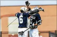  ?? MARK PALCZEWSKI/FOR DIGITAL FIRST MEDIA ?? Joey Taylor (6) and Brendan Meagher (11) of La Salle celebrate Meagher’s goal against Manheim Township in the PIAA Class 3A boys’ lacrosse championsh­ip at West Chester East High School in West Chester, PA on Saturday, June 9, 2018.