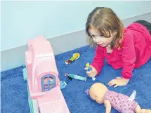  ?? ERIC MCCARTHY/JOURNAL PIONEER ?? Macey Handrahan, one of the 17 children who attends CHANCES’ new location in O’Leary, finds a quiet corner to play while grand opening celebratio­ns are being held.