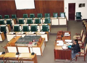  ?? PHOTO BY CHRISTOPHE­R SERJU ?? Committee clerk Grace-Ann Morrison is a lonely figure as she awaits members of the Regulation­s House Committee of Parliament at Gordon House yesterday. The meeting was scheduled to start at midday but at 12:37 p.m., the clerk summoned persons from the...