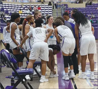  ?? Tony Burns/News-Times ?? Discussing matters: El Dorado’s girls basketball team huddles during a break in the action in their contest against Camden Fairview at Wildcat Arena. The Lady Wildcats will be back in action tonight when they host Maumelle. The game is scheduled to begin at 6 p.m. with the varsity boys game to follow.