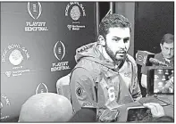  ?? AP/CURTIS COMPTON ?? Oklahoma quarterbac­k Baker Mayfield answers questions during Saturday’s media appearance after missing the previous two days while recovering from the flu during Christmas break.