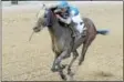  ?? NYRA PHOTO BY CHELSEA DURAND ?? Effinex, with jockey Angel Arroyo, won the Grade 3 Excelsior at Aqueduct April 25. The NYbred died after suffering an acute rupture of the pulmonary artery at McMahon of Saratoga Thoroughbr­eds Wednesday.