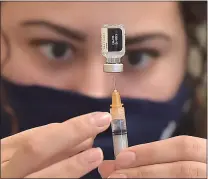  ?? MEDIANEWS GROUP — DAILY TIMES ?? CVS pharmacist Gianna Santangelo draws a single dose of the Pfizer BioNTech COVID-19vaccine during a clinic at The Watermark at Bellingham in East Goshen.