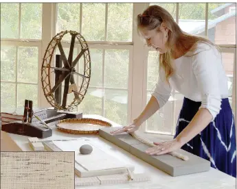  ?? Keith Bryant/The Weekly Vista ?? Susan Byrd rolls cut washi, or Japanese paper, before the strands will be separated and spun into thread.