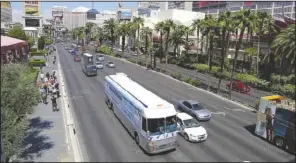  ??  ?? DOWN THE ROAD: The Hangover Heaven bus makes its way down Las Vegas Boulevard to pick up a patient at a Strip casino on April 15 in Las Vegas.