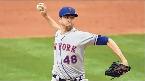  ?? Greg Fiume / TNS ?? Jacob deGrom of the New York Mets pitches against the Washington Nationals on Sept. 26 at Nationals Park in Washington, D.C. DeGrom is the Mets’ top starter, but the rotation after him is up in the air for the 2021 season.