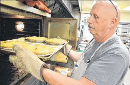  ?? SHARON MONTGOMERY-DUPE – CAPE BRETON POST ?? Terry Macleod works in his Sweet Side of the Moon Bakery and Café in Glace Bay, N.S.