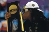 ??  ?? Stanford forward Francesca Belibi kisses the trophy after defeating Arizona in the women’s NCAA final.