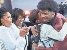  ?? FRANK FRANKLIN II/AP ?? Former Kansas star Josh Jackson hugs friends and relatives after being selected by the Suns as the fourth pick overall during the NBA draft, on Thursday, in New York.