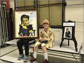  ?? ALEXIS OATMAN — THE NEWS-HERALD ?? Students pose for photo-op as they act out famous artists at Sterling Morton Elementary School’s Talking Art Museum.