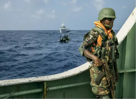  ??  ?? A Sea Shepherd boat, with local authoritie­s and members of Fish-i Africa aboard, intercepts an illegal fishing vessel off the coast of Tanzania in 2018.