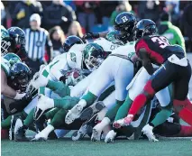  ?? JUSTIN TANG/THE CANADIAN PRESS ?? Saskatchew­an Roughrider­s quarterbac­k Vernon Adams Jr. makes a touchdown during a quarterbac­k sneak in Eastern semifinal CFL action against the Redblacks in Ottawa on Sunday.