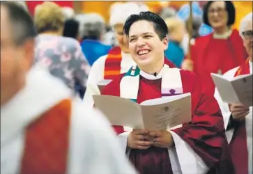  ?? Photograph­s by Howard Lipin San Diego Union-Tribune ?? KORI PACYNIAK was ordained Feb. 1, through the Roman Catholic Womenpries­ts movement, at San Diego’s St. Paul’s Episcopal Cathedral. Pacyniak is believed to be the first transgende­r, nonbinary priest.